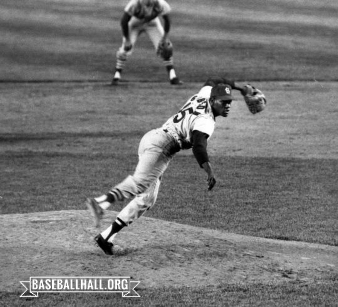 baseballhall's tweet photo. The strength, tenacity and sheer excellence of Bob Gibson’s World Series start #OTD in 1964 embodied all that we love about Game 7s. Gibson gutted out a complete game to get the @cardinals their first Fall Classic title in nearly 20 years. Pic: Fred Roe https://t.co/REZbXRKVNa https://t.co/wxw23dt2eI
