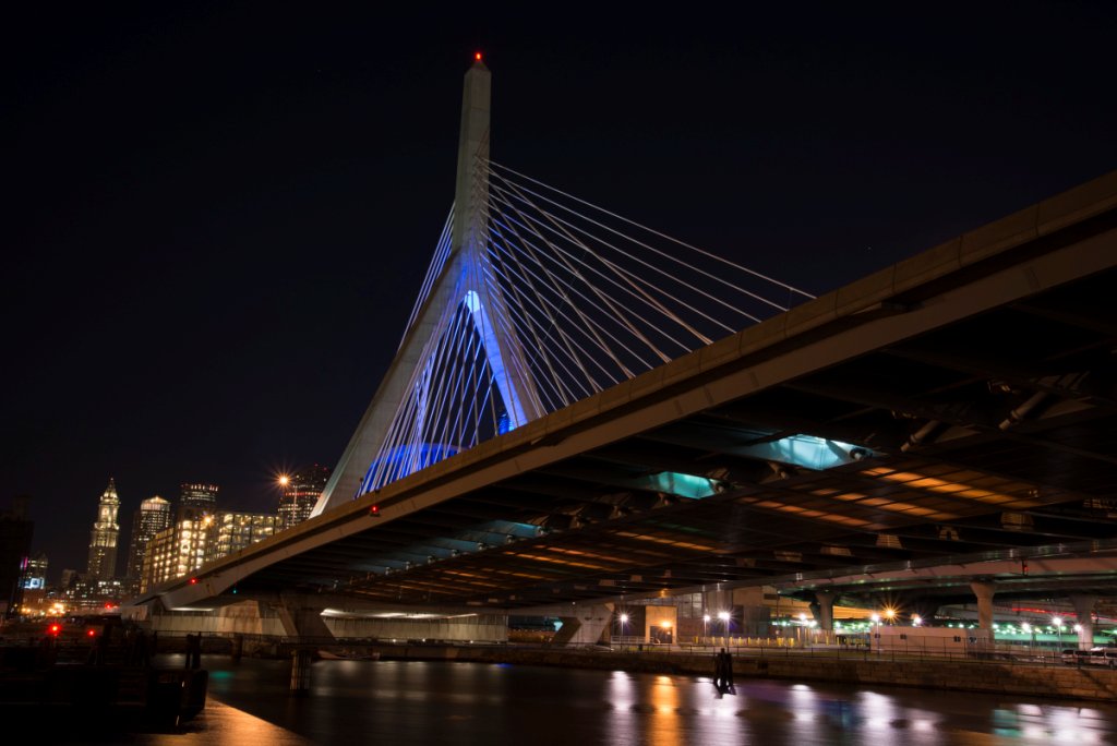 MassDOT's tweet photo. #ZakimBridge will shine Blue tonight, Tuesday, October 15th, for the @MGHNeurology #FrontotemporalDisorders Unit in honor of their upcoming annual gala event Friday. @FTDUnitBoston https://t.co/pkCXNC7BUv