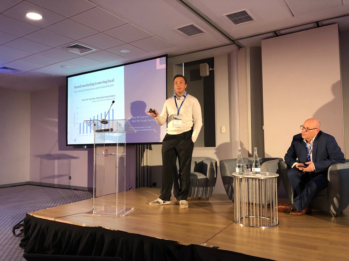 Siinda's tweet photo. Local Search Summit speaker Norman Rohr of @getuberall 
discusses the Age of Near Me and Voice Search.
Searching by speaking is a whole new way of approaching search that is just as useful as it is unavoidable. 

#Uberall #SIINDA #LocalSearchSummit #VoiceSearch https://t.co/T3i3zOQo7d