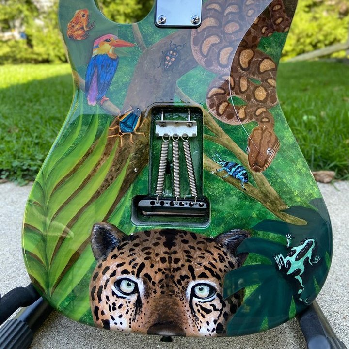 MuktwnMusicCafe's tweet photo. So excited! Here’s a sneak peak of our stunning Midnight Magic raffle guitar! Hand painted by three gifted Carroll University art students, Jaryn Bear, Alex Olson, and Taylor Uselmann. Tickets will be available soon... all proceeds will be donated to Mukwonago Fine Arts Boosters! https://t.co/ivDMv79HF6