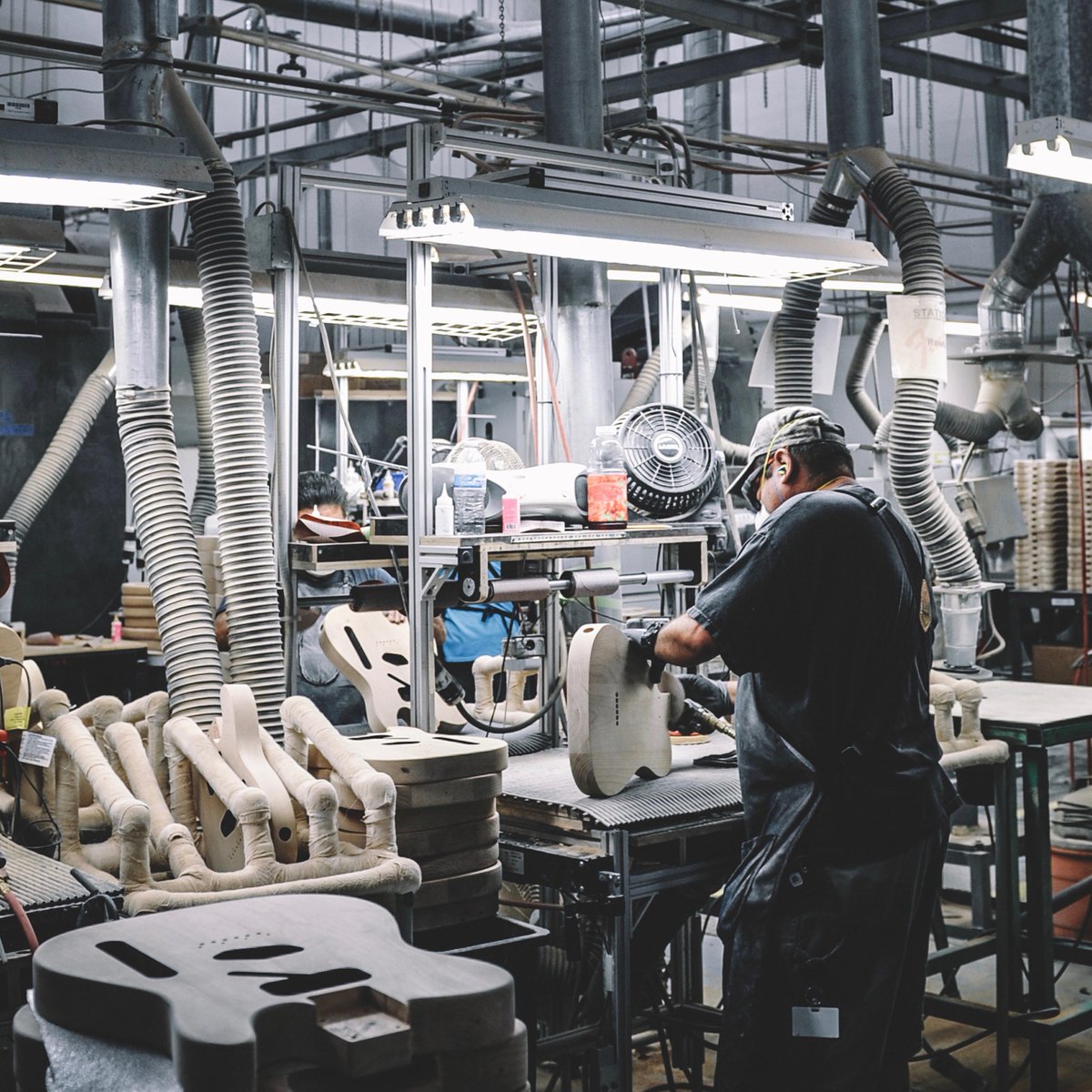 Fender's tweet photo. Our skilled guitar builders strive to create the finest instruments for players around the world. Please join us in celebrating our factory workers on #ManufacturingDay! #MFGDay19 https://t.co/piyXWnVzC1