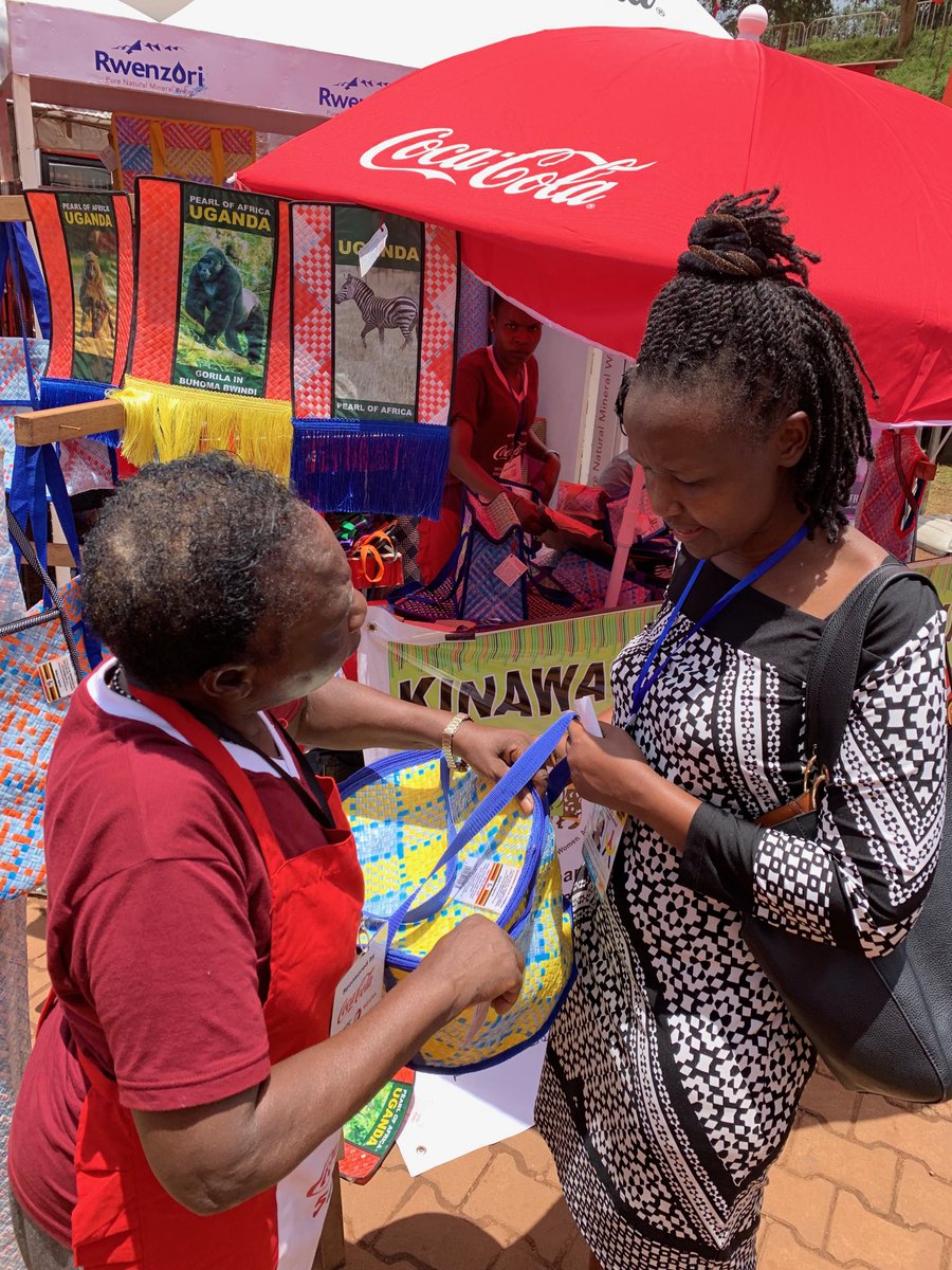 skaheru's tweet photo. Flavia Nabaasa (right) met Benedicta Nanyonga of Kinawataka Women’s Initiative, who makes various items out of used straws. #UGITF2019 @newsUMA https://t.co/x1eLU98APf