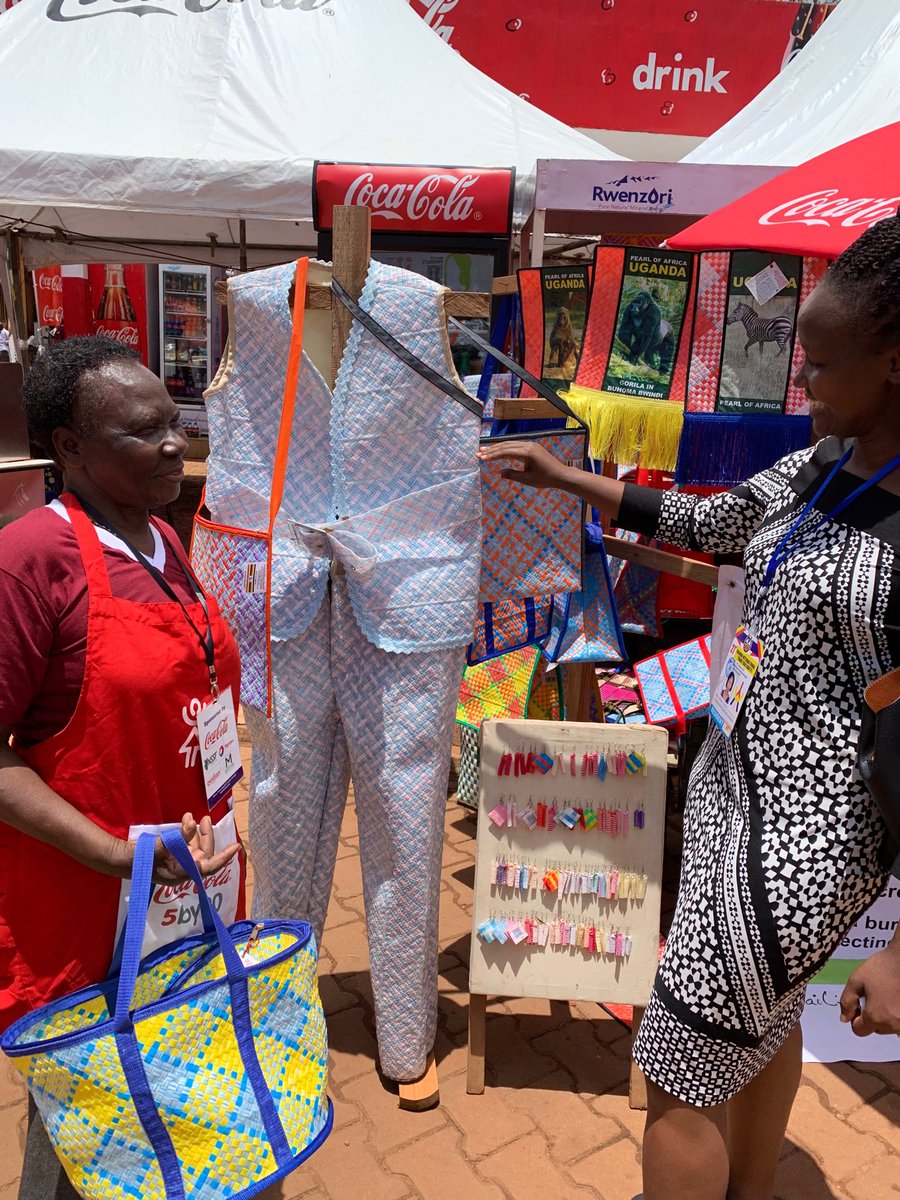 skaheru's tweet photo. Flavia Nabaasa (right) met Benedicta Nanyonga of Kinawataka Women’s Initiative, who makes various items out of used straws. #UGITF2019 @newsUMA https://t.co/x1eLU98APf