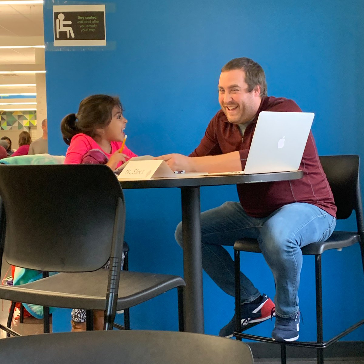 SPPSLynch's tweet photo. Consider passing out free books to the little siblings of your 6-12 students at conferences. You'll have kids reading multiple books over the course of the night, kids reading on the floor, and kids even reading with a science teacher who was free. @sppscass @SPPS_News https://t.co/py355deTjp