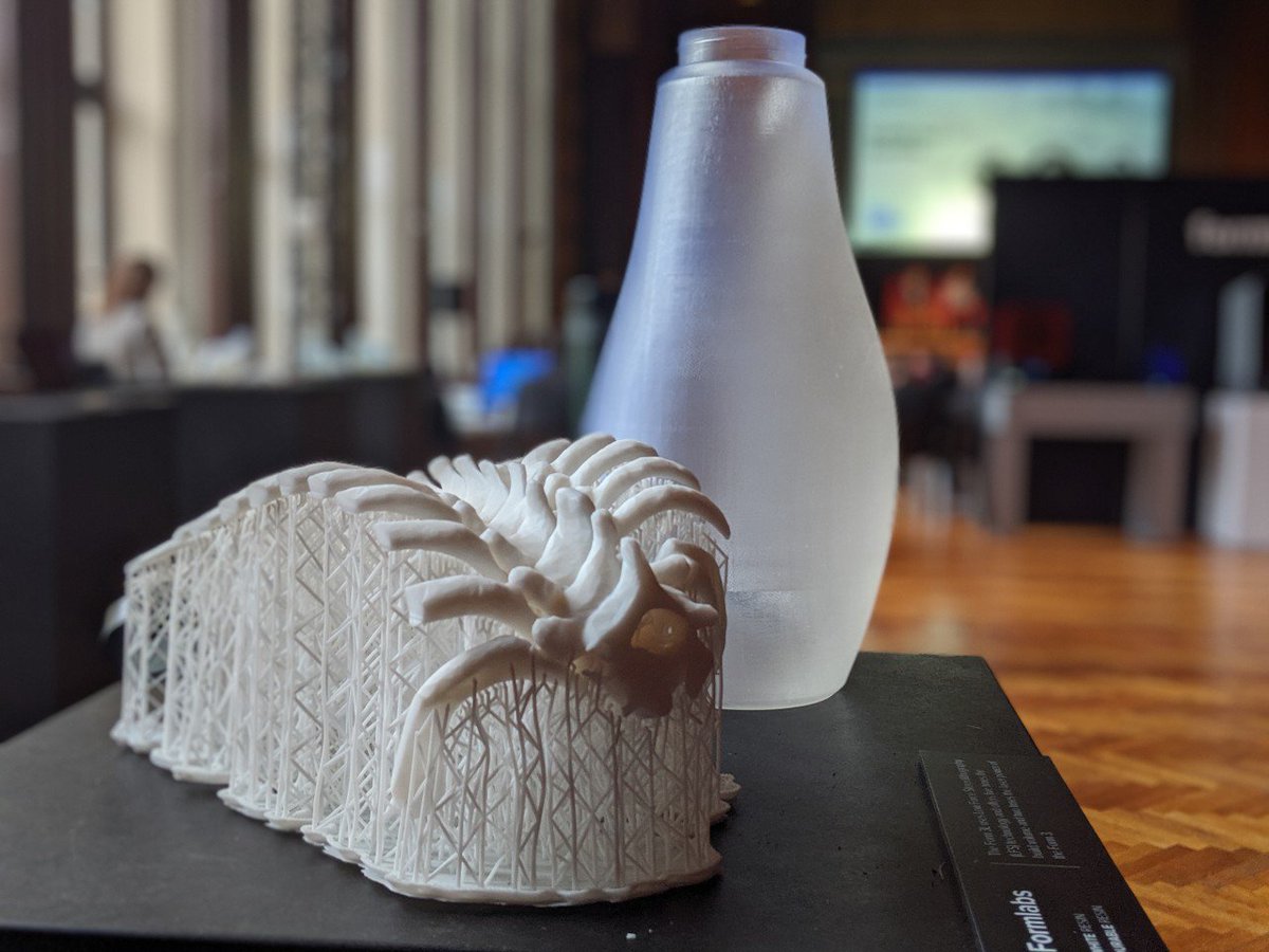 formlabs's tweet photo. Big parts printed on the Form 3L featured at #FUS19:
• Spine in White Resin
• Bottle printed in Clear Resin
• Dymaxion Cube in Clear Resin
• @OXO spoon in White Resin https://t.co/P1NZalEeHq