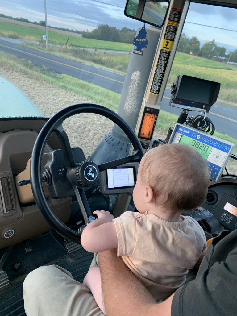 RuralQueen90's tweet photo. Reagan drove her first tractor last night at 10 months old. She’s a natural! #FarmHer #HarvestHero @Cjones776 https://t.co/KMyZN2bjY0