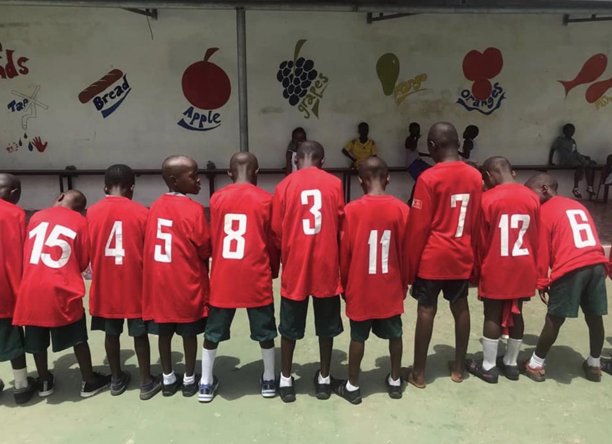 Look at their football shirts! Donated to some of our students for football and sports!
