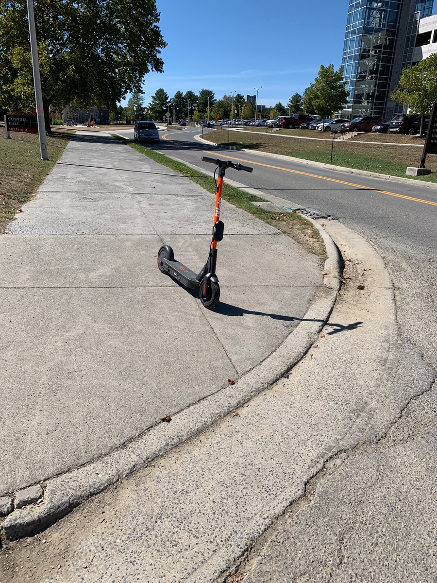 VirginiaTechSSD's tweet image. Campus community reminder regarding use of e-scooters: Please do not block access by parking your e-scooter on the sidewalk or places that block access. This photo represents an #AccessFail where an e-scooter is parked in the middle of a curb cut. @gettingaroundvt @virginia_tech