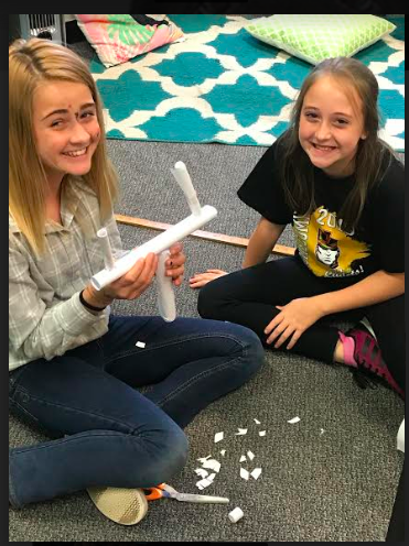BlakePeck14's tweet photo. In the spirit of homecoming week🏈🖤❤️💛, 6th graders were challenged to make a goal post that could stand upright. Using 5 pieces of paper, 12inches of Tape, Scissors and a yardstick. 4th graders came in to judge and talk to the groups about their goal post. #IFACadetPride https://t.co/U9l34NrnBS