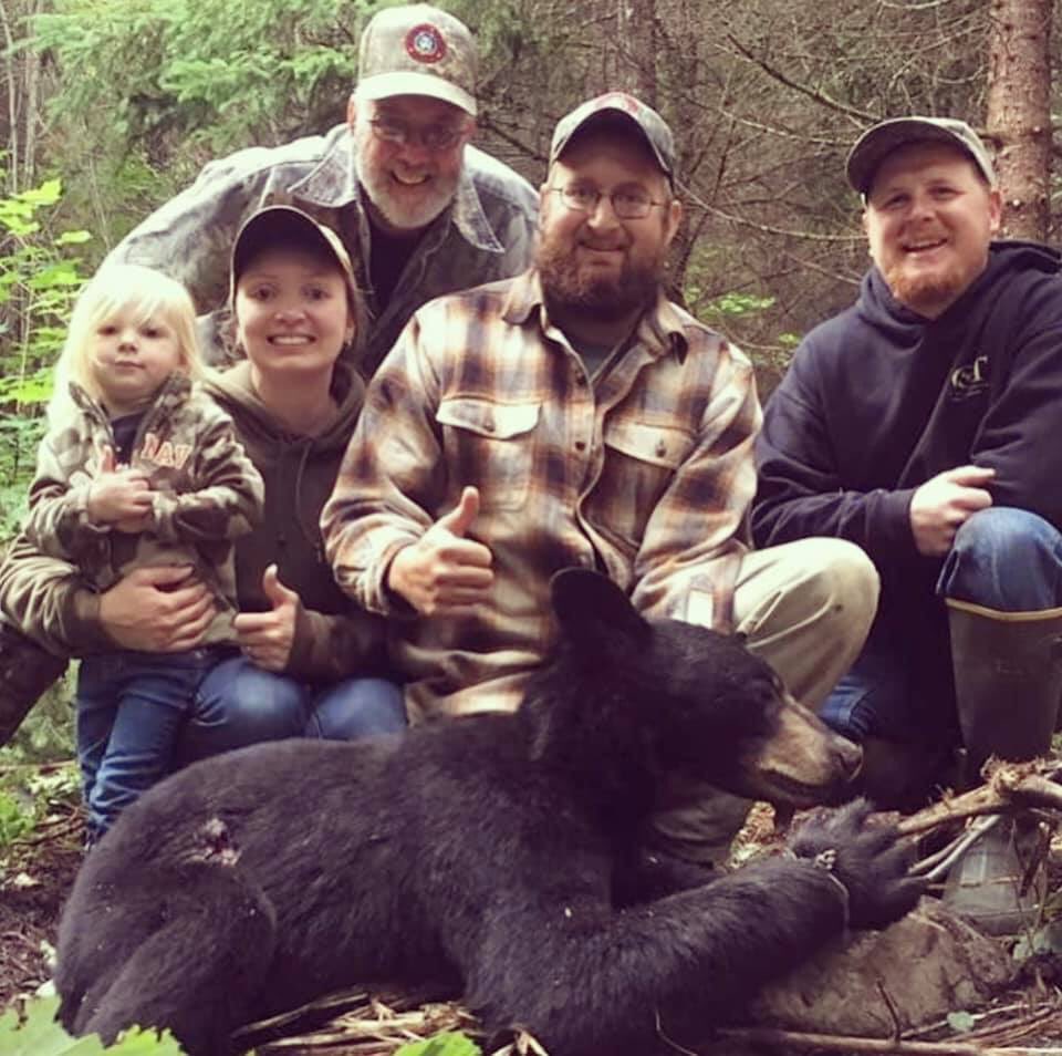 XposeTrophyHunt's tweet photo. What a family photo...so proud of this tiny little bear they killed with the help of Bounty Hunter Guide Services &amp; dogs! Add a little girl posing with the little dead bear. Innocence lost. How can they be preening with such pride..😒
#BanTrophyHunting 
please RT
@rickygervais https://t.co/wI9EQWNCyY