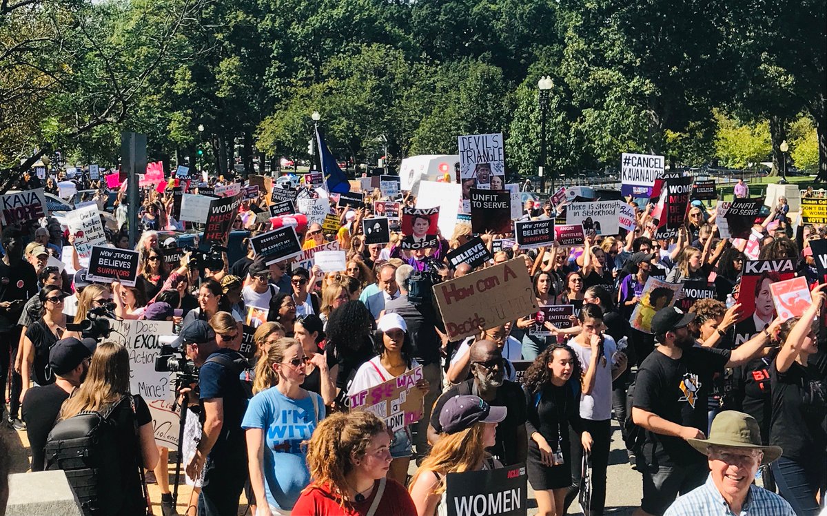 A crowd of people march in DC on October 4, 2018 to oppose Brett Kavanaugh's confirmation.