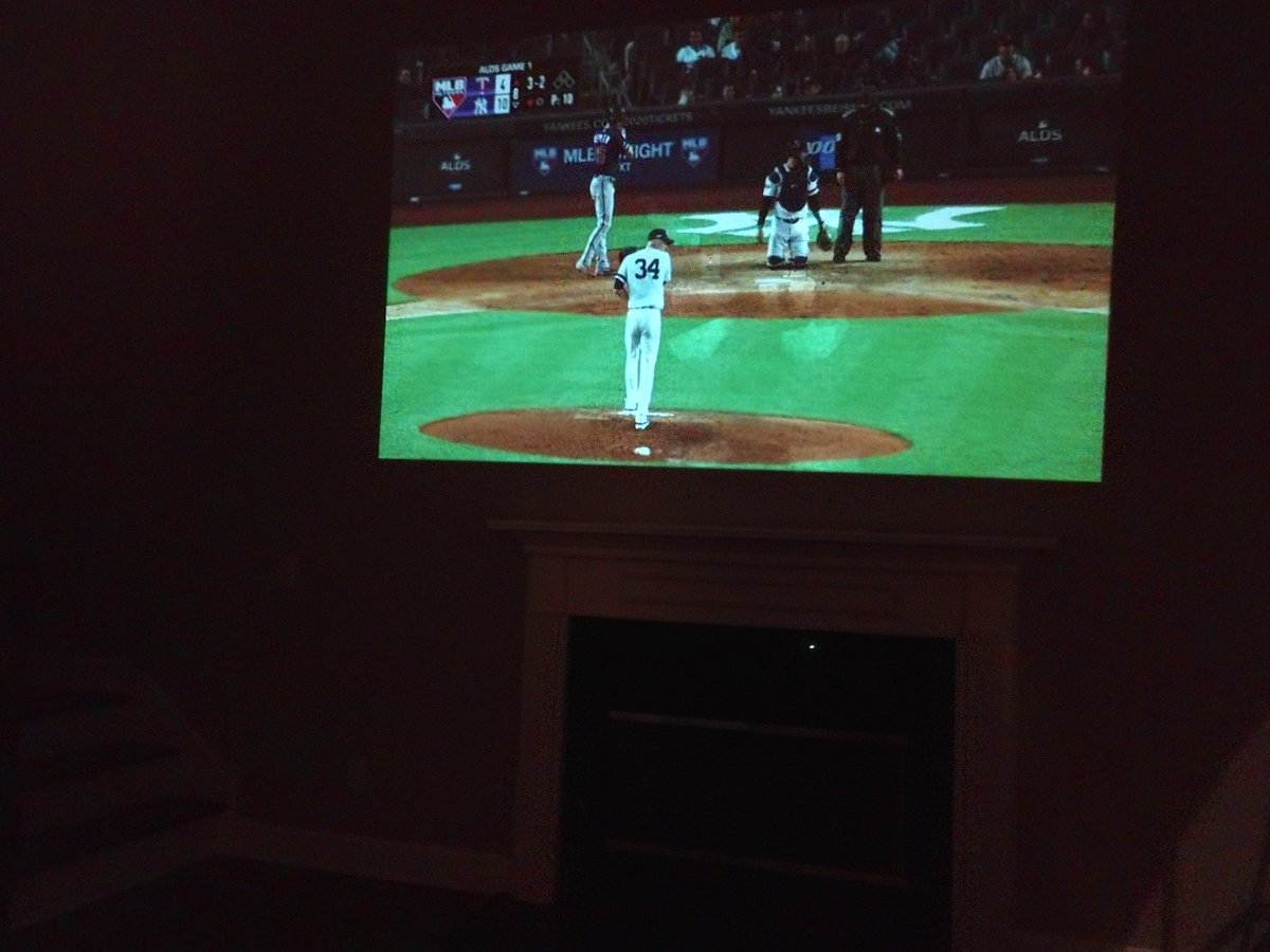 GeneRapMusic's tweet photo. No TV in the Brentwood TN house and my beloved @Yankees are in the playoffs.  No problem! My Moto Z phone from @verizon has a projector attachment!!!  Not quite @yankeestadium but pretty cool. #GoYanks https://t.co/GZ5srem69I