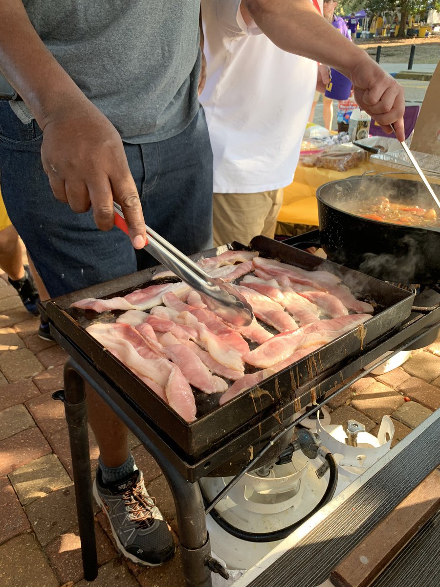 G_eaux_'s tweet photo. A little something different on the menu at tailgates for this 11 a.m. kickoff. Bacon, cheese grits, and Raisin Cane’s French Toast (yea you read that right) https://t.co/iZIoridv9S