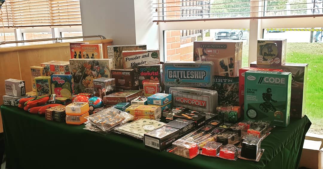 We are all set up for a family fun comic-con today! (A sneaky Sam in the background setting up his miniature painting workshop) 

#comics #games #bathbombs #dice #rpgs #minis #painting #kidsday #familyfun #weekend
