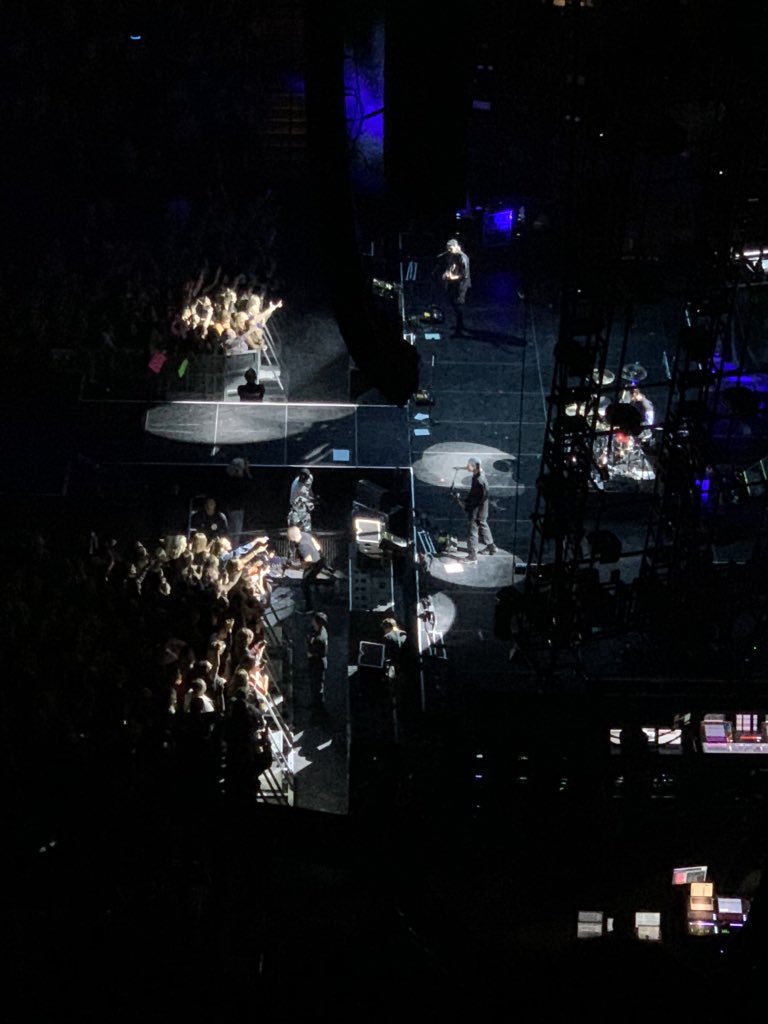 AAthreat11's tweet photo. Trying to see @Ashton5SOS through these speakers is like trying to see the Minneapolis skyline through the the rain and clouds today 😭 @5SOS #stpaul #xcelcenter #stillloveyouashton https://t.co/C88XZfce8K