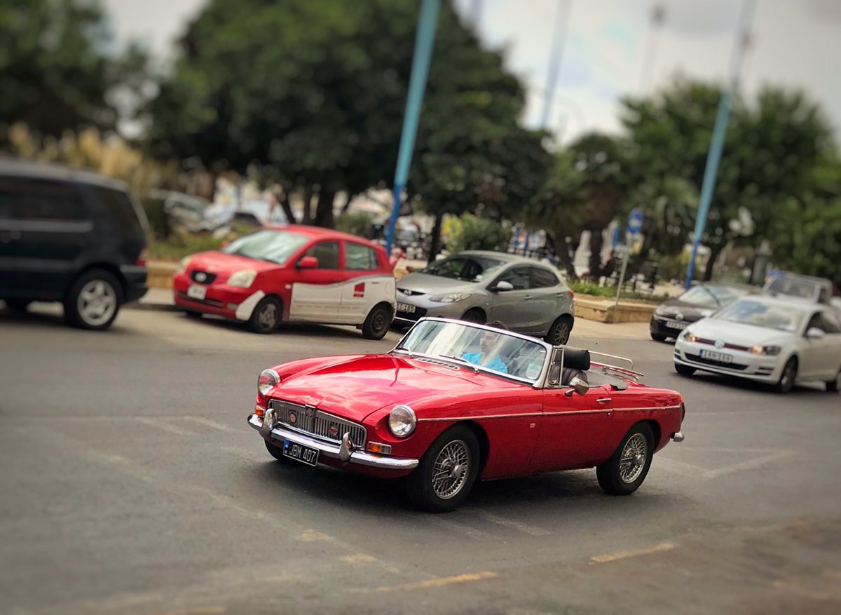 W0rd5w0rth's tweet photo. #SundayMorning #ClassicCar spot in #Malta, this gorgeous #MGB roadster cruising along #Sleima bay. https://t.co/0Cmnpq2A4x