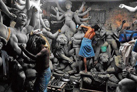 clay from mother  #Earth taking shape of Mother Goddess Devi Durga-MahishasurmardiniMahamayaMahavidyaMatrikaAmbikain hands of our artists at Kumhartola(they spell Kumartuli?) kumortuli on banks of Hooglysince centuries jeevan chakra goes on #ecofriendly pooja