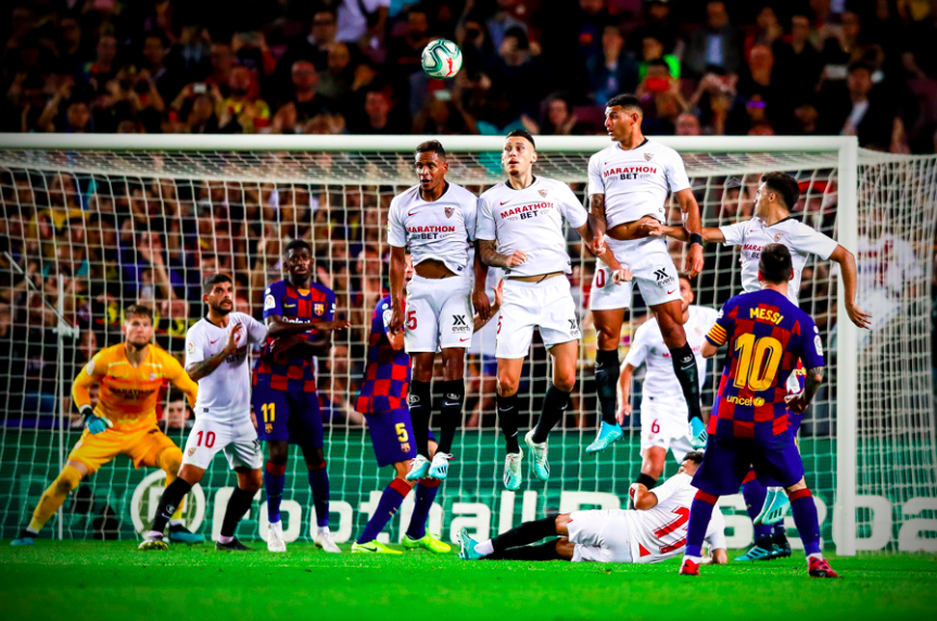 ESPNFC's tweet photo. Four man jumping wall. Player lying on the ground. Player on the post. Goalkeeper going the right way.

Still can't stop a Lionel Messi free kick 🎯 https://t.co/u8mxed1hEv