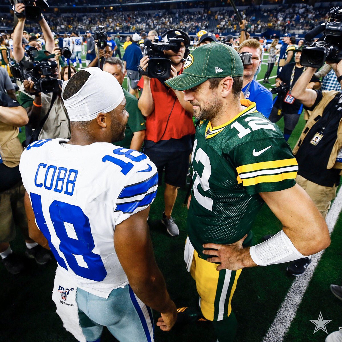 dallascowboys's tweet photo. .@rcobb18 🤝 @AaronRodgers12 

#FootballIsFamily https://t.co/R0ooe56XWW