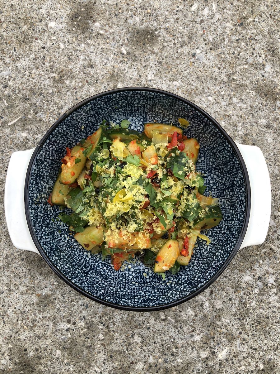 Marinated cucumber salad with fermented black beans, maple Calabrian chili, basil, cilantro, cured egg yolk. #kingdough #kingdoughpizza #weeklyspecial