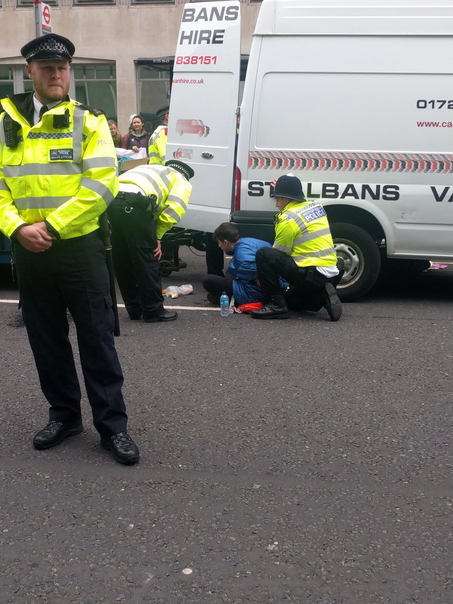 ScotlandXr's tweet photo. #XRScotland rebels outside BEiS locked on to van and trailer with #PowerInTruth infrastructure. Currently being arrested. We've had 4 arrests so far today. https://t.co/PnxMvBtDVr