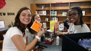 godwin_library's tweet image. Mr. Young&apos;s class came in to pick up a new choice read...and spent a little time reading them as well.  And...our library aides decided that today would be a good day to bedazzle some of our library passes.