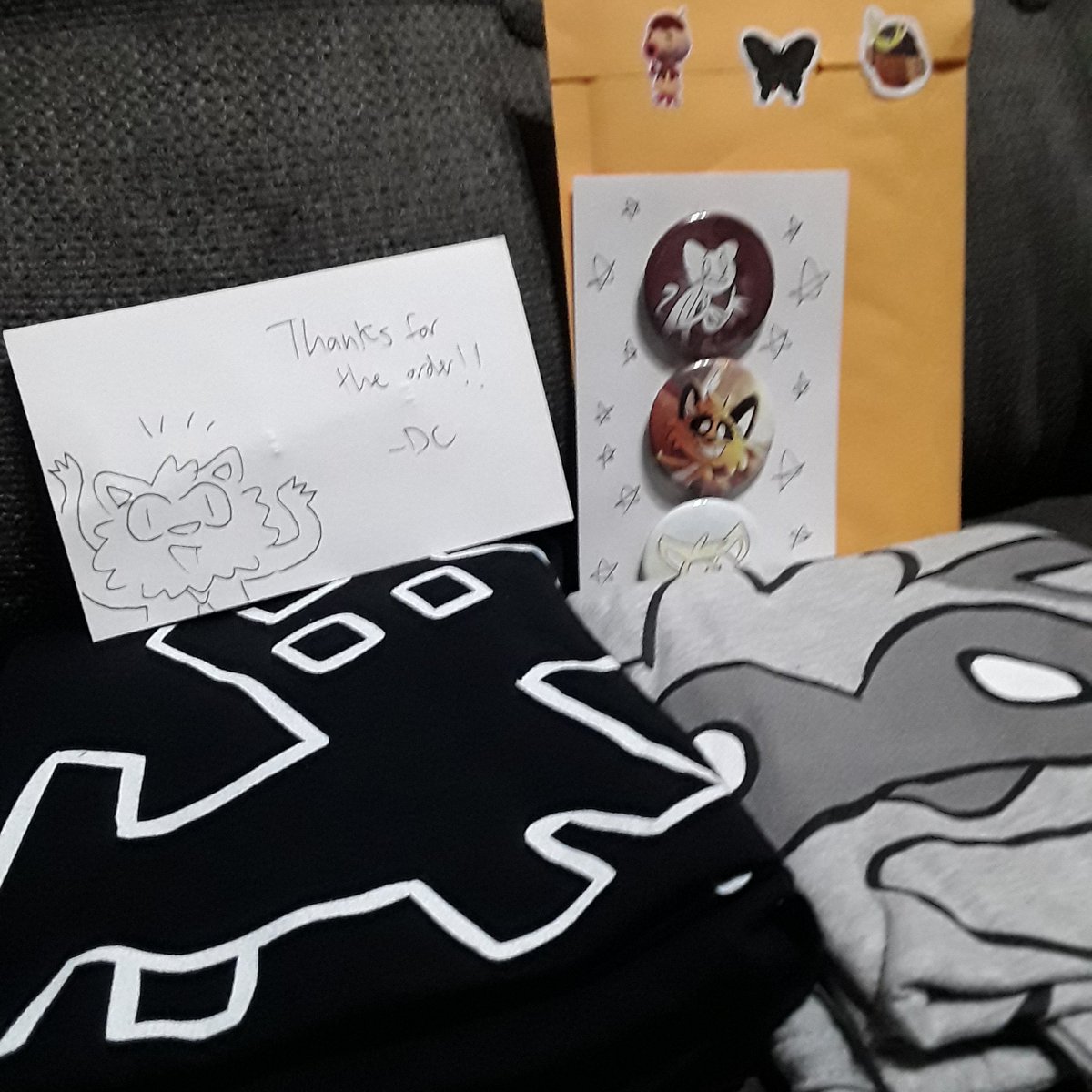 vulpinexxx's tweet photo. @DeadlyComics Your work is amazing and I love your merch, thank you so much! These pins and shirts are awesome, and the card will definitely be saved. Keep doing your thing! https://t.co/Rjla0Iw2Rt