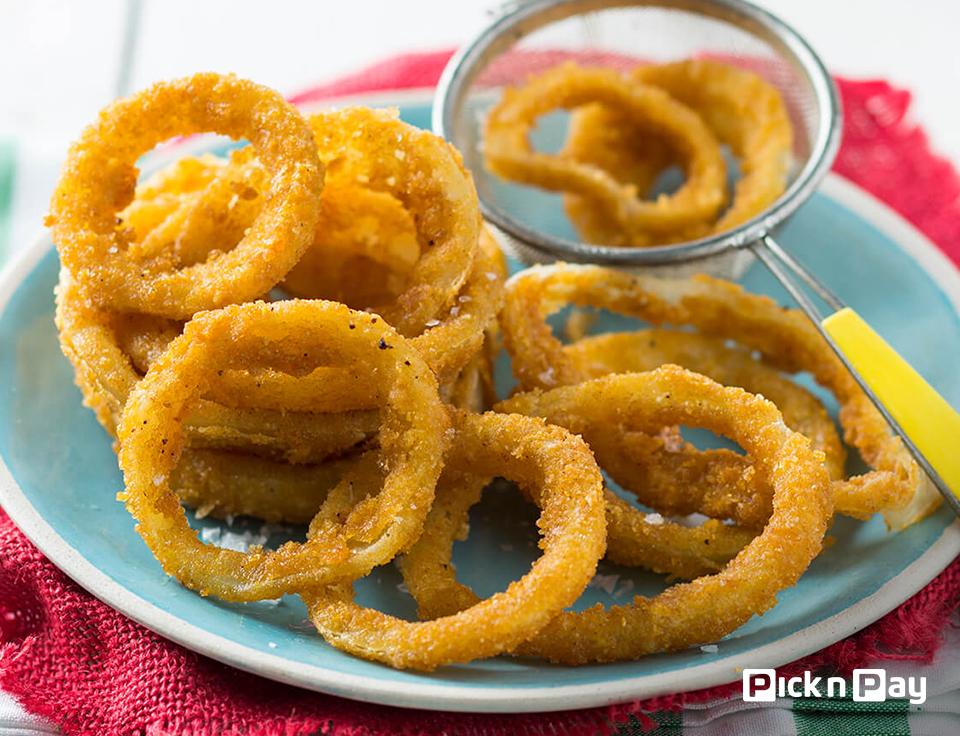 PicknPay's tweet photo. These onion rings make the perfect side dish or light snack. We’ve used a secret ingredient to get them extra crispy. Click the link to find out what it is #PnPSummerSorted > https://t.co/RFYmKsSTpa https://t.co/UCuTeRWeXy