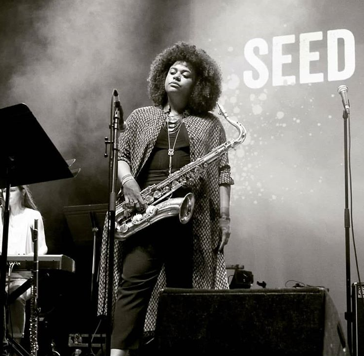 Jazzwise's tweet photo. The Roundhouse Rising festival runs from 15-29 October with a genre-smashing programme. Catch a tasty triple bill of saxophonist Chelsea Carmichael plus funky-five-pieces PYJÆN and Nihilism, all appearing 18 Oct on the Deeper Cuts night, full line-up here https://t.co/HYOTDooduz https://t.co/vwaWObP170