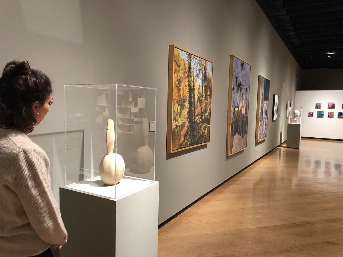 A visitor takes a closer look at Marlene Jack’s “Asymmetrical Vase,” 2016 in our current exhibition “Faculty Show 14.”