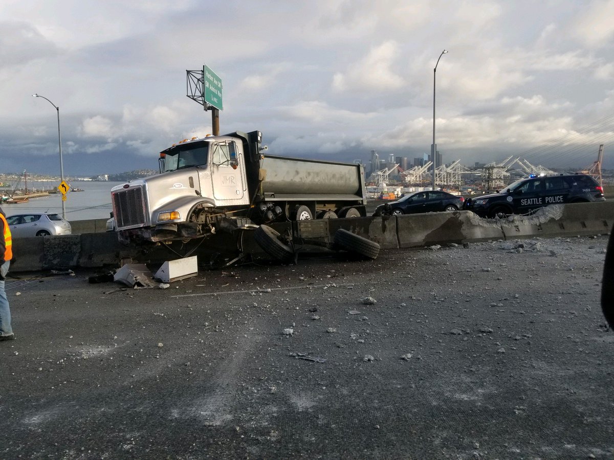 westseattleblog's tweet photo. Scanner: Bridge closed BOTH WAYS now b/c dump-truck crash.  Reader photo https://t.co/EfjFj7IML2