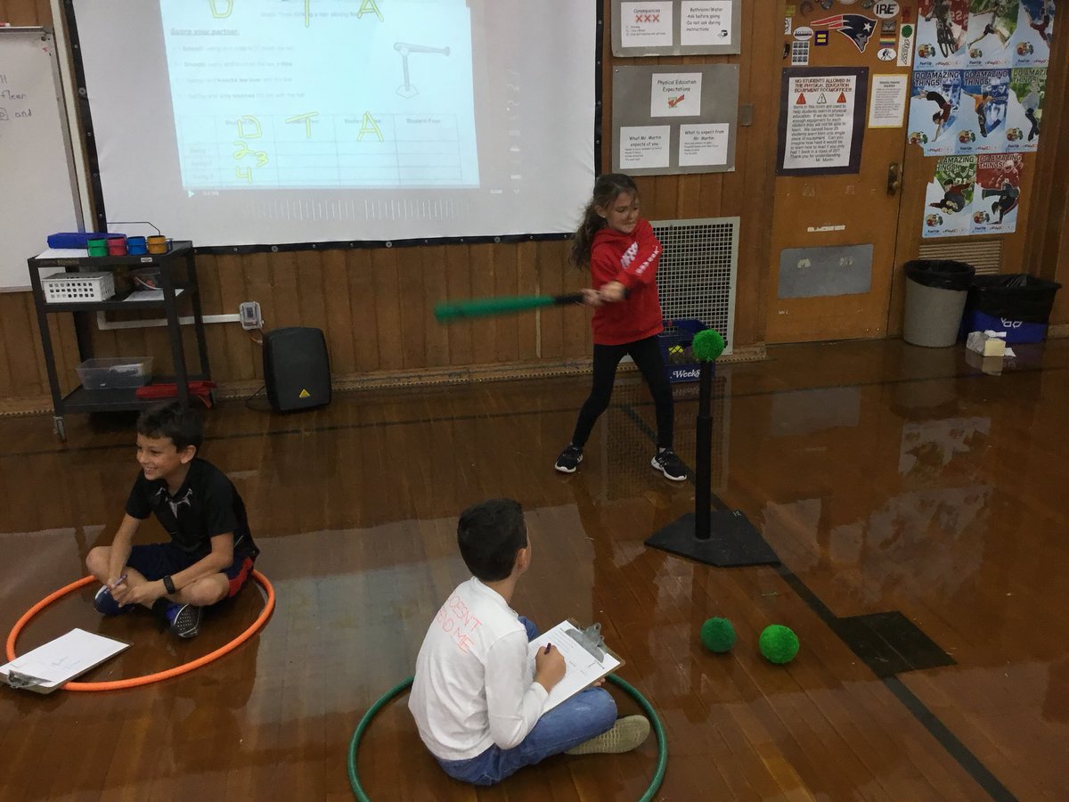 MrDarlingPE's tweet photo. Stuck inside? No problem!  Third grade students striking a stationary ball. Skill check coming up....peers are helping to check our smooth swing! @mes_rockets https://t.co/yey4bIvn4M