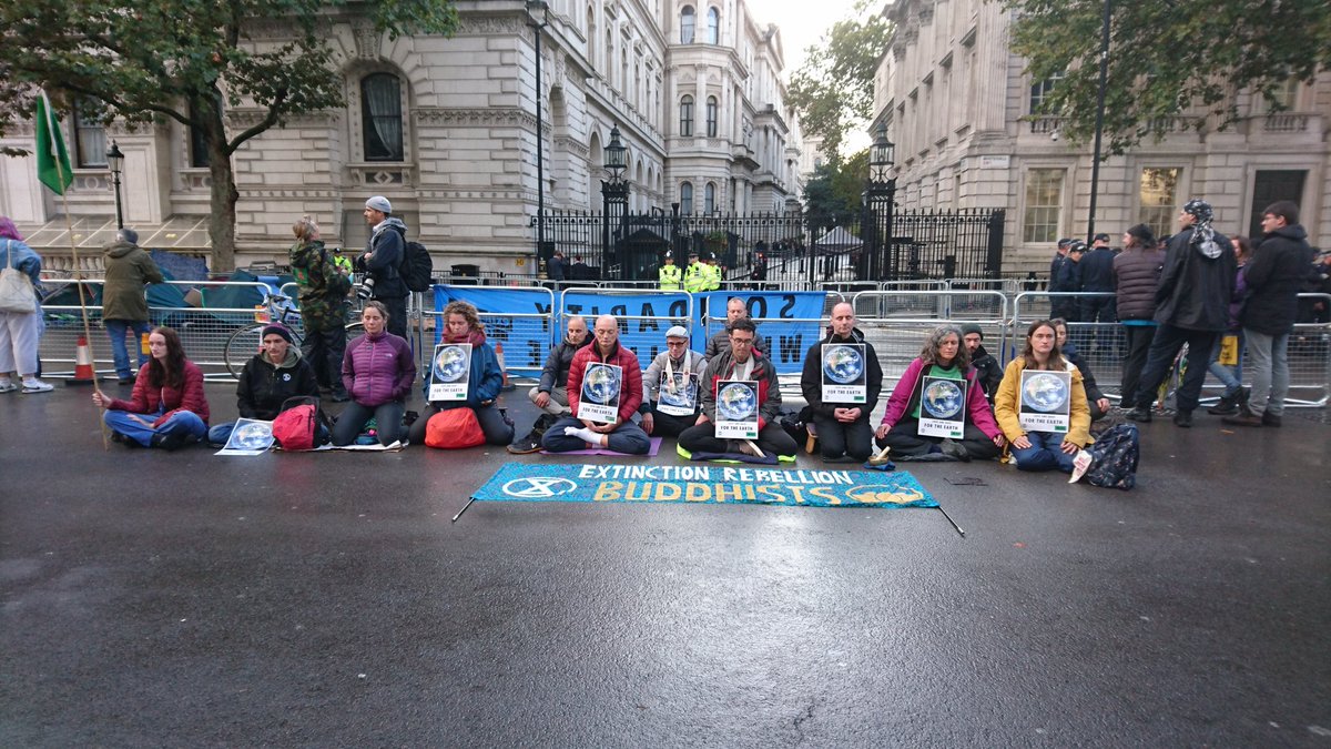 MonicaHone's tweet photo. Now outside Downing Street
#ExtinctionRebellion
#extinctionbritain
#Buddha
#Buddhism https://t.co/neAuAg94rl
