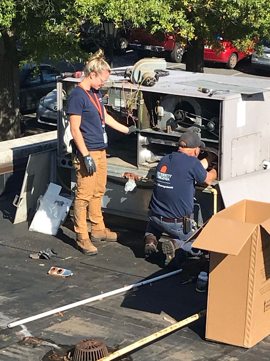 UVAApprentice's tweet photo. My name is Ashley, and Iβm a 1st-year HVAC apprentice. I learn something new every day thanks to my #1 on-the-job trainer, Chip! Today we put in a new heat exchanger on top of Alumni Hall. #winteriscoming #apprentice #skilledtrades #earnlearnadvance #uva #womenintrades #hvac https://t.co/lzh6xJN2Cd