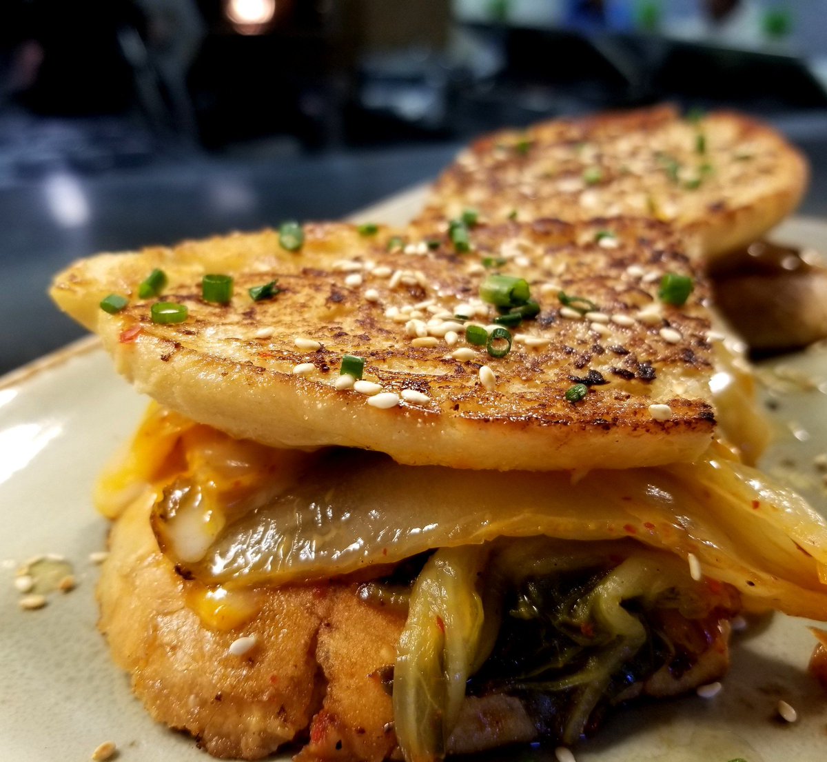 Sesame Buttered Kimchee Grilled Cheese / Bánh Mi Bread / Gochujang Mayo / Vegetarian Kimchee / Cheddar / Provolone / Drizzle of Fermented Garlic Honey / Sea Salt / Chives