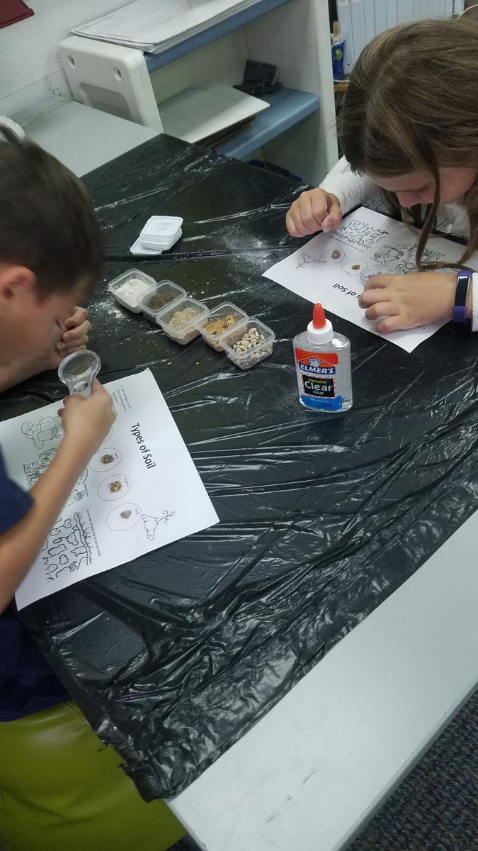 Second graders exploring rocks by sorting sizes, types, and hardness.  Parent science teacher support made the learning that much better.  Learning about volcanoes was not a bad part either.
