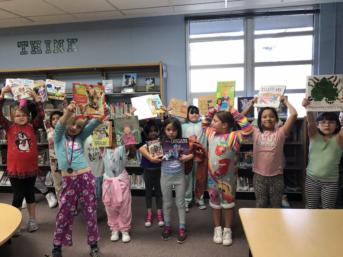 Vivian2nd's tweet photo. Class pj day and library checkout! What could be better?! #2ndgrade #TeamVivian #VivianES #readersandleaders https://t.co/tpKGA2ELyg