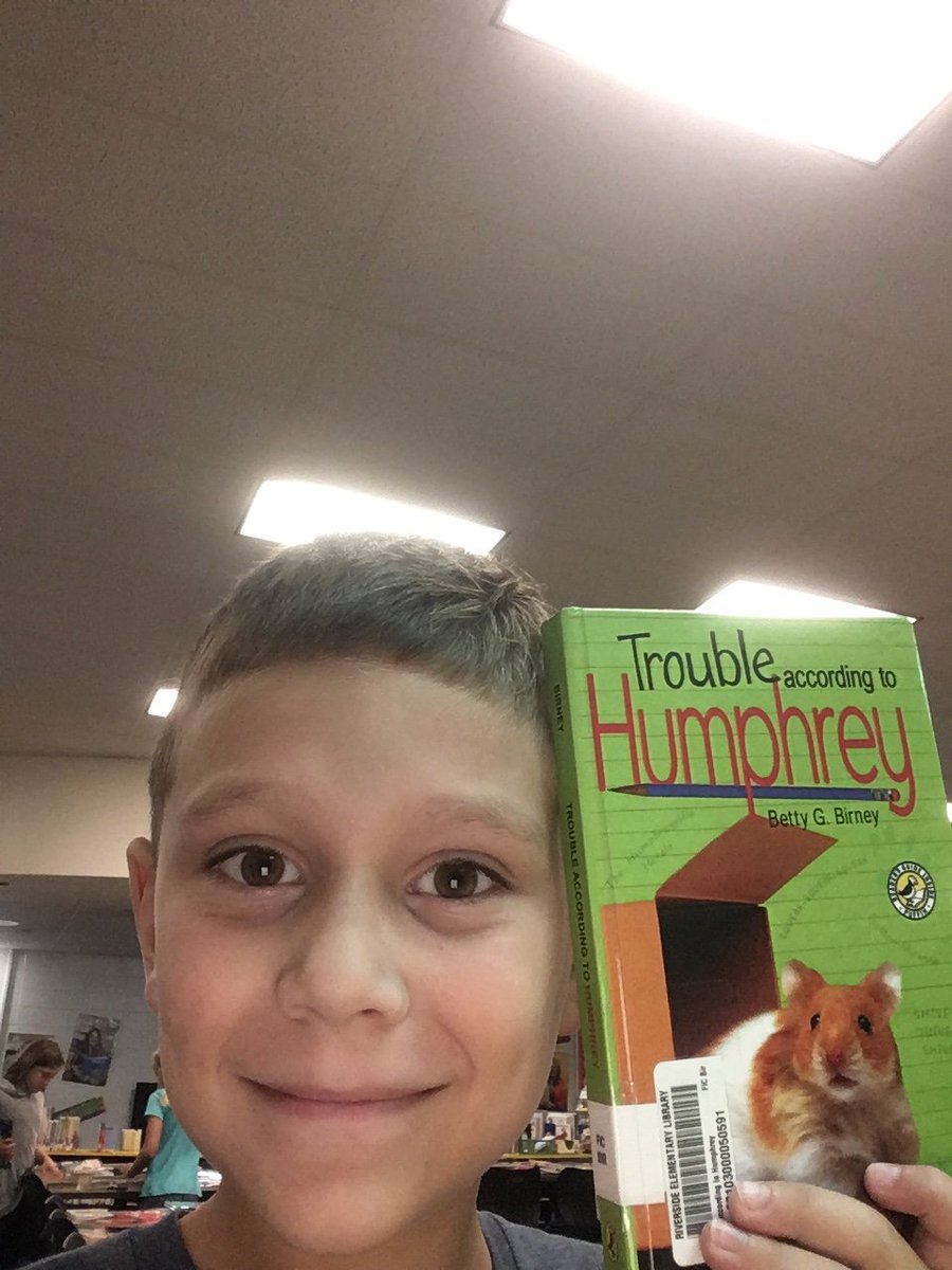 MrsDembowski's tweet photo. More Riverside students taking selfies with their library books - Love the smiles! #Riversidereaders #everestpride https://t.co/Q5nz9Ex5uJ