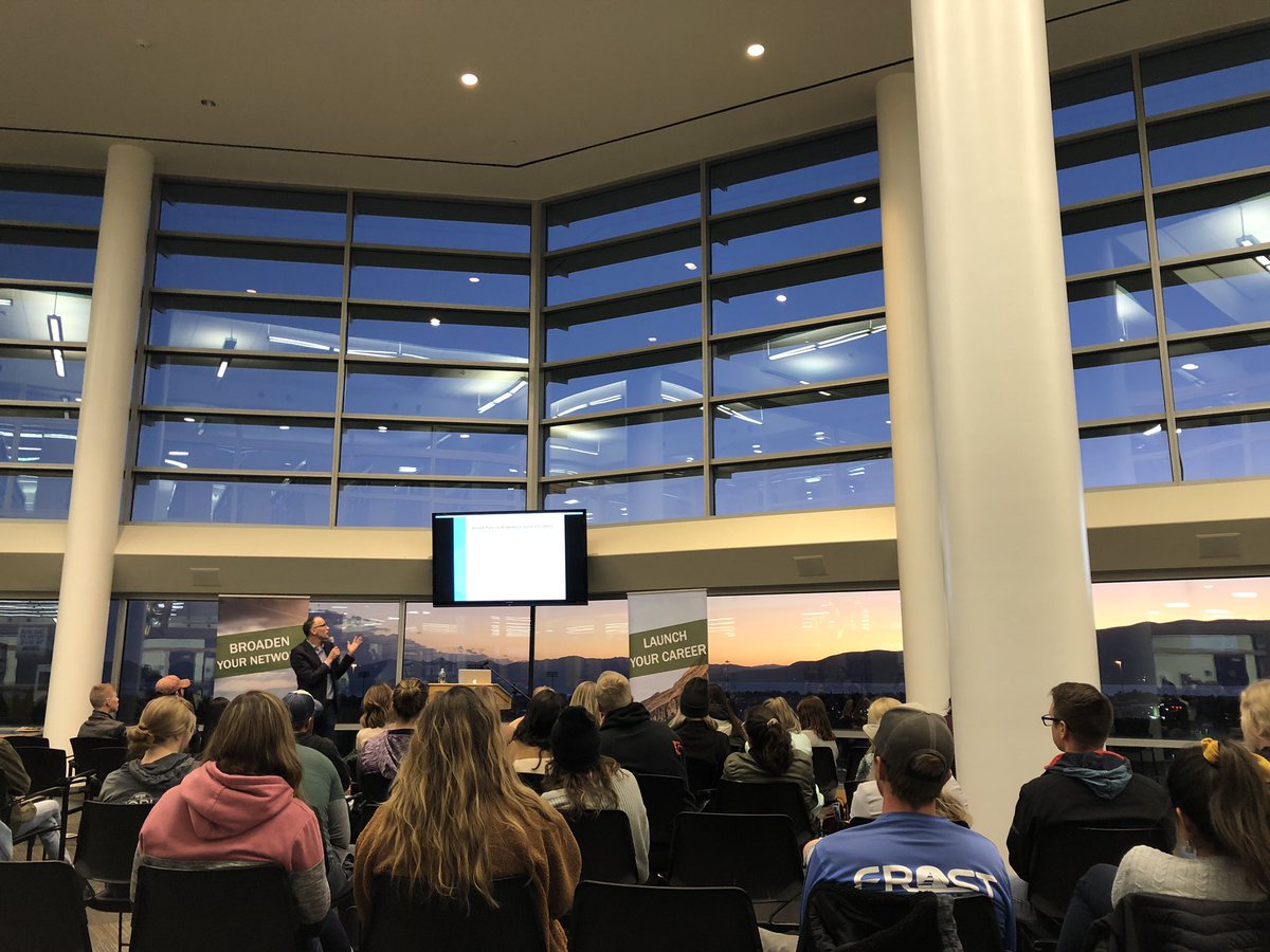 meaghanmckasy's tweet photo. The sun sets over Utah Lake as @IntrepidChris shares his insights on #crisiscommunication with @UVUPRSSA, @UVUcomm, and other @UVU students. Such an engaging and interesting conversation! #publicrelations https://t.co/FiBn8j5jDF