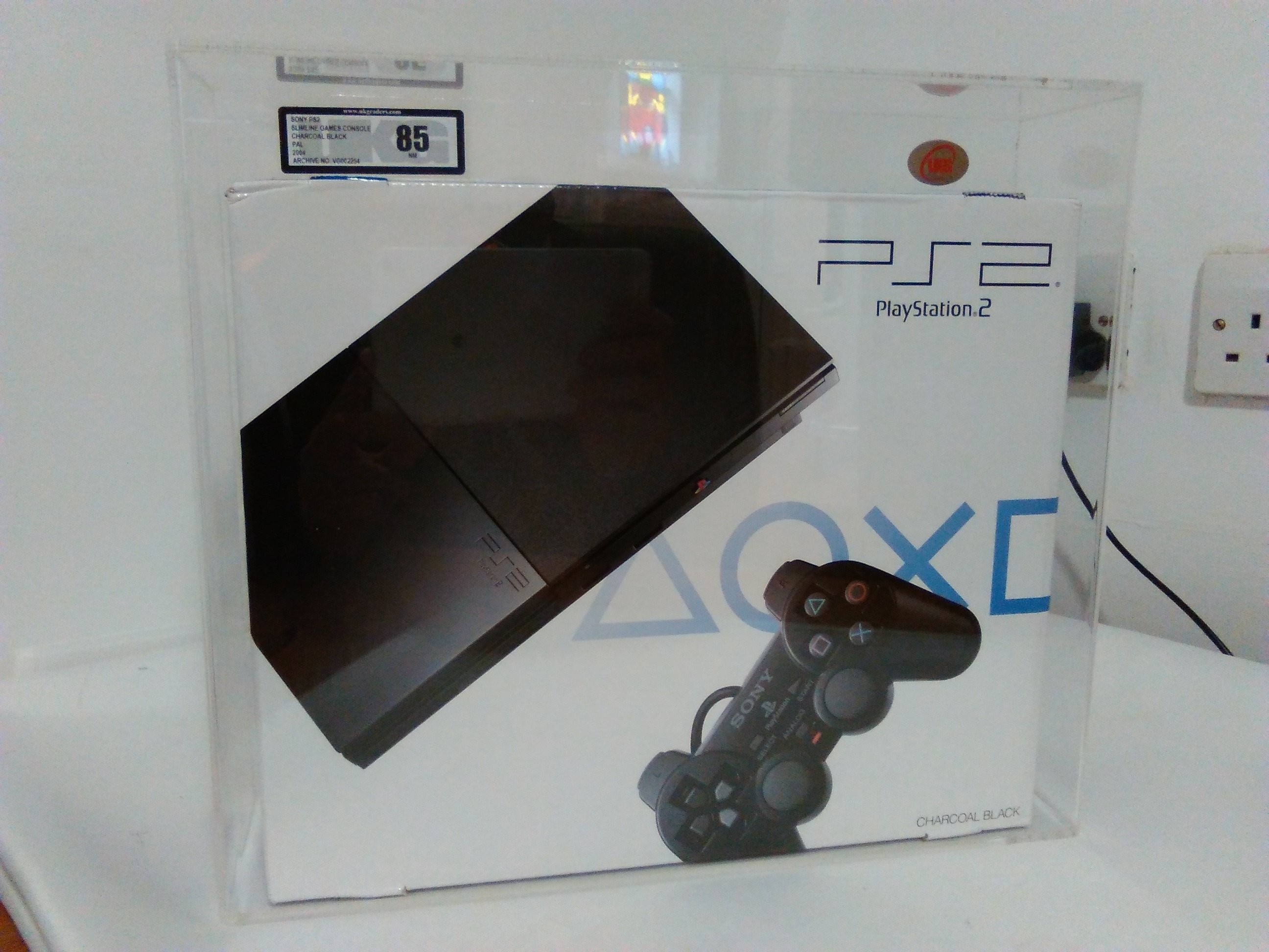 udvikling belastning bred The Toy Planet on Twitter: "#Playstation2 (PS2 SLIM) CONSOLE BLACK - MODEL  SCPH-90004 SEALED UKG GRADED 85NM. Graded by UK GRADERS COLLECTABLE GRADING  COMPANY, at 85 Near Mint. Comes Sealed inside a