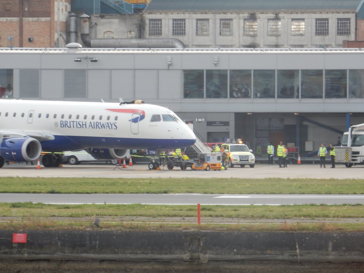 It's an eventful day at work. A guy has glued himself on top of a plane at London City Airport just across from me. #londoncityairport