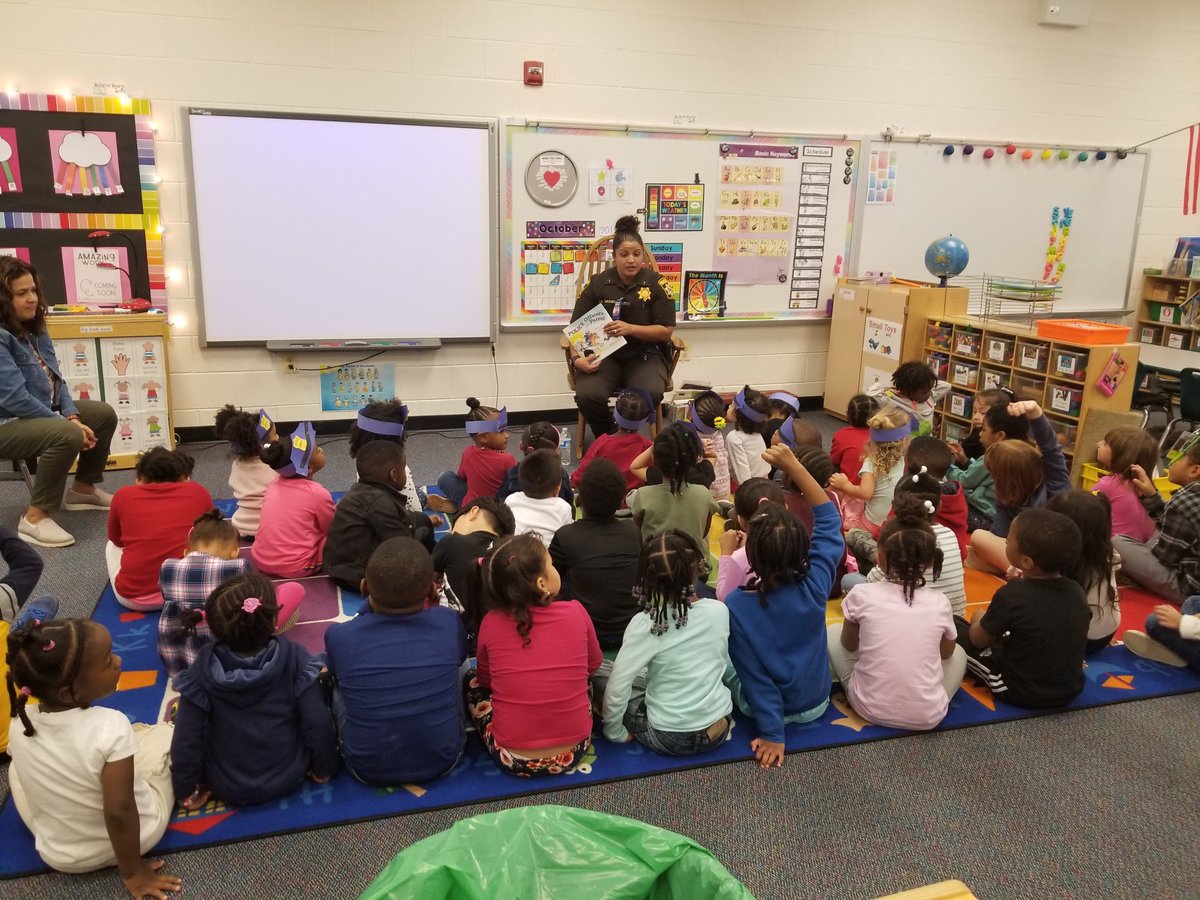 Officer Brown reads to our 3's Program. #CommunityHelpers