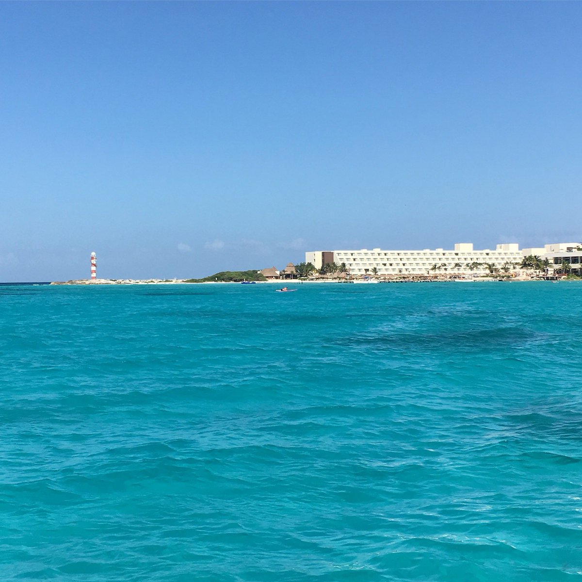 CathySchutte's tweet photo. #tbt #Cancun as seen from the beautiful, blue sea. #CaribbeanSea #MarCaribe #tropical #PuntaCancun 🌴🌊🌴 https://t.co/p6CK8ECFY2
