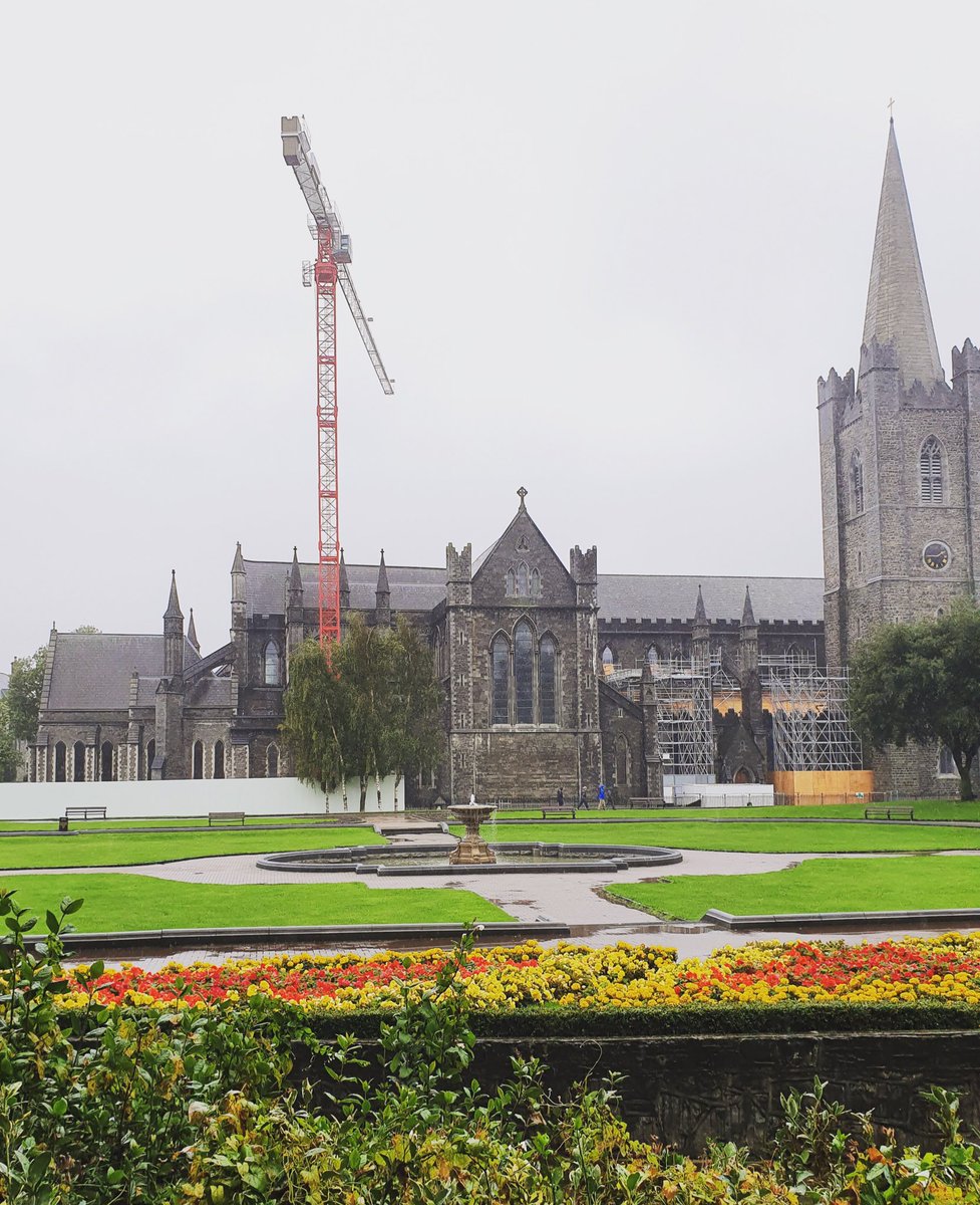 b2_architects's tweet photo. From Across the Park: The tourists have deserted the park but the tower crane faces the rain and continues to build the Phase One Scaffold at St Patrick’s Cathedral. #stpatrickscathedral #clancyconstruction https://t.co/KwlCt36W5n