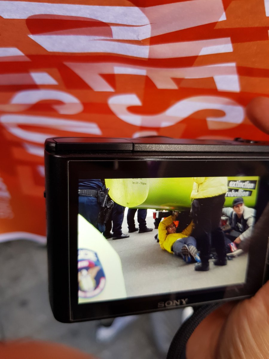 Times Sq still blocked; #ExtinctionRebellion activists holding on tightly -- seems they are pretty attached to their vessel... #XRNYC <a href="/XR_NYC/">Extinction Rebellion NYC 🌎</a> #ClimateAction #civildiscobedience