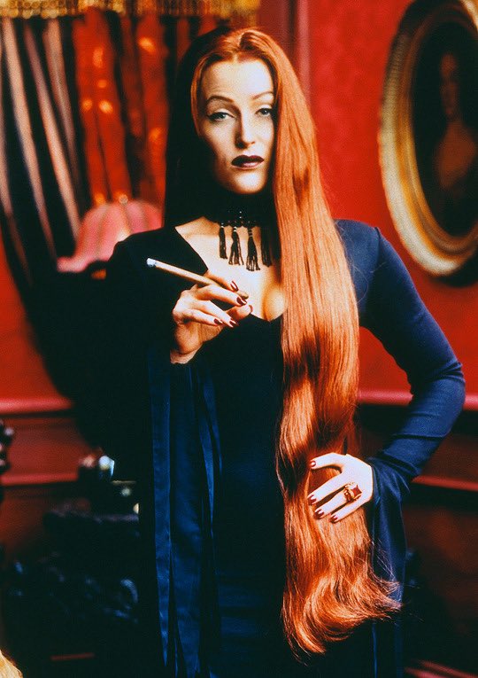 I can’t believe I had to find this picture of Gillian Anderson dressed as Morticia Addams all by myself and no one beamed it directly into my brain