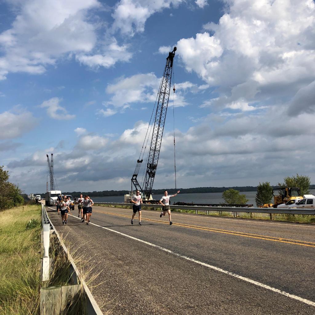 NavyFederal's tweet photo. The Sooner Ball has arrived in Texas! The @UofOklahoma ROTC Battalion has crossed the Red River on their way to Dallas. #RedRiverRun https://t.co/nEbxxXJiAx