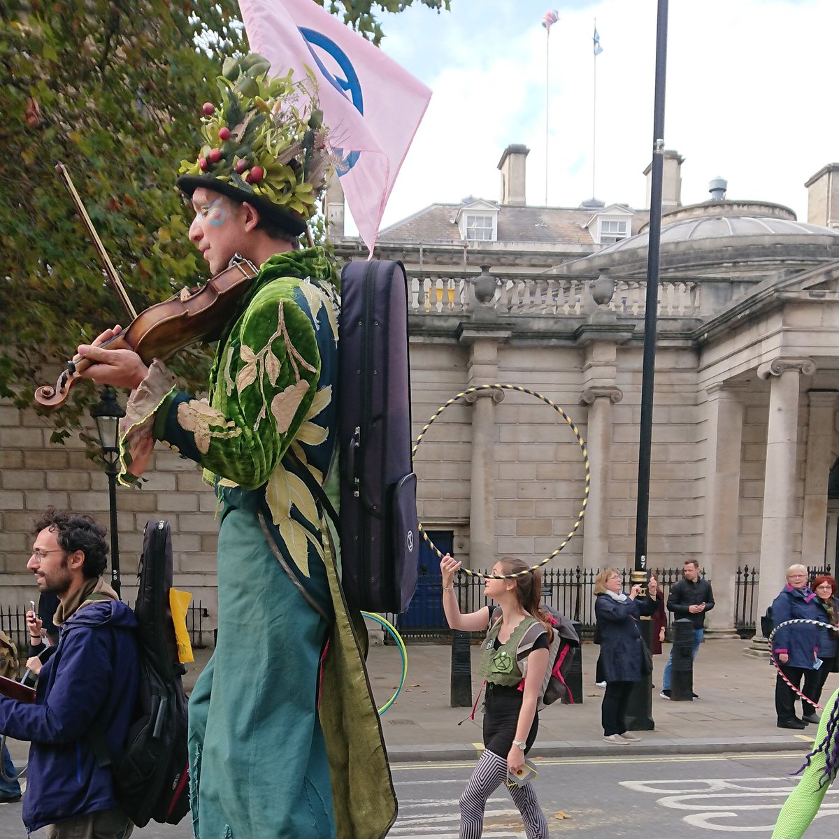 JasonMorell's tweet image. Giant on violin. Extinction Rebellion. Whitehall.