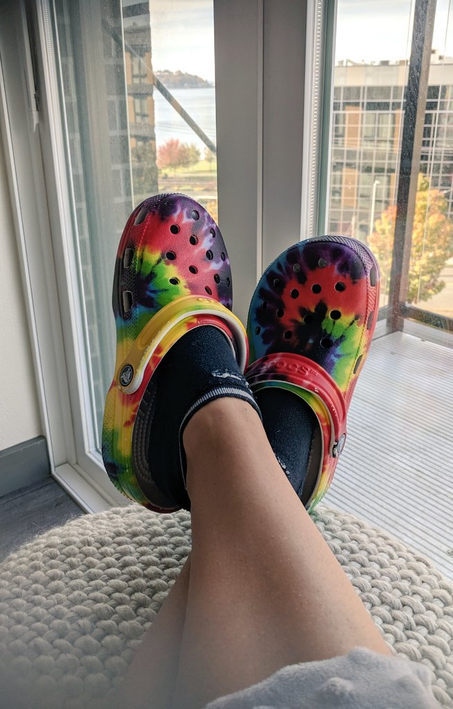 tie dye crocs on feet