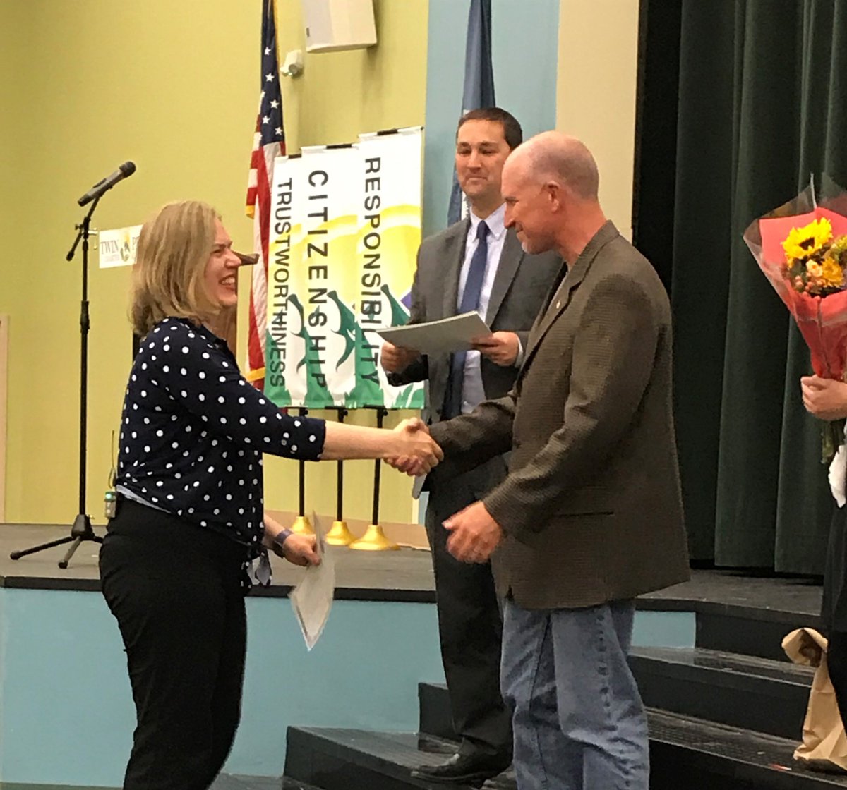 Students at Twin Peaks Charter Academy in Longmont, Colorado, studied citizenship in class, then hosted a naturalization ceremony for a teacher there and 25 others who became new U.S. citizens. 